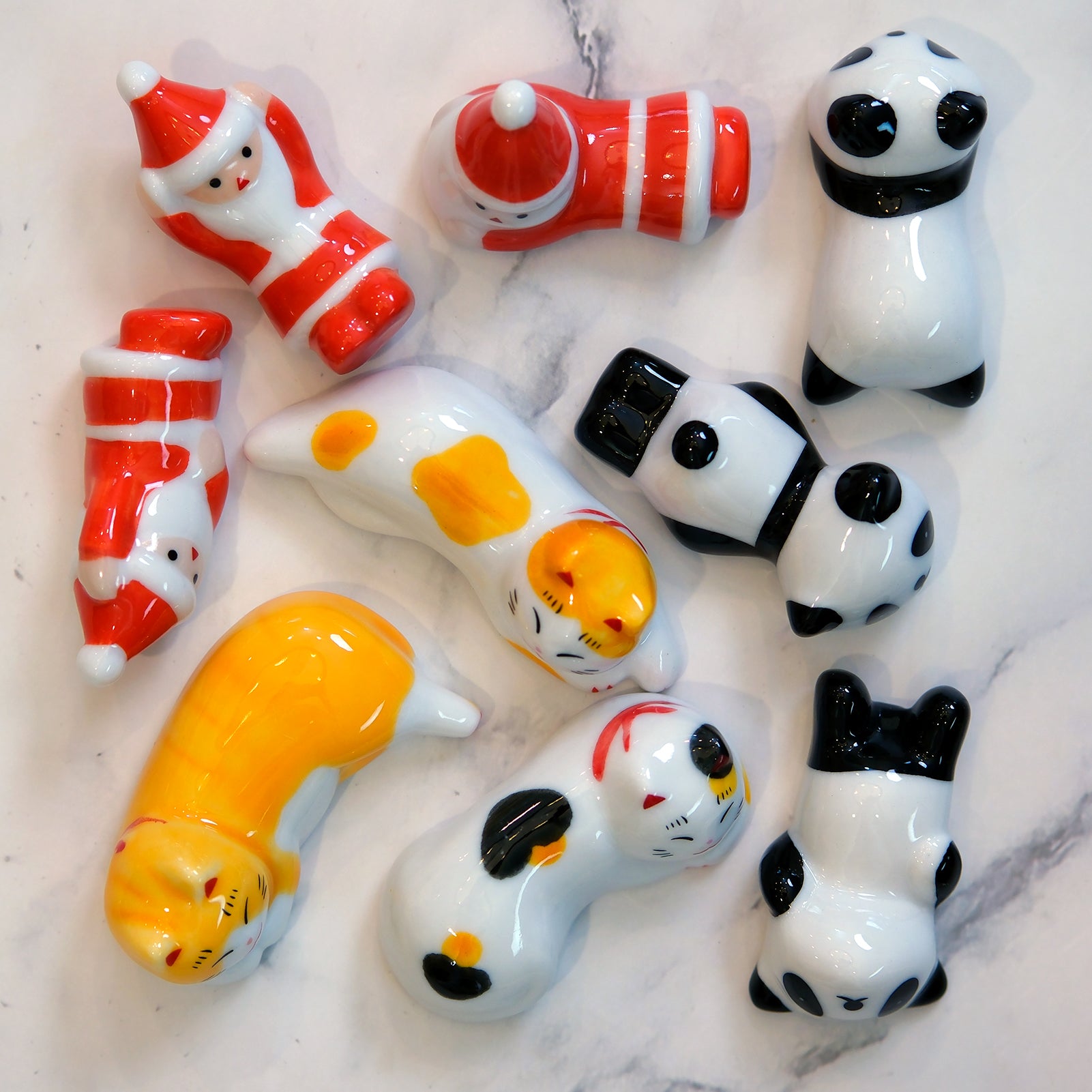 Handcrafted Ceramic Chopsticks Rest with designs of cats, pandas, and Christmas Santa Claus (9PC)
